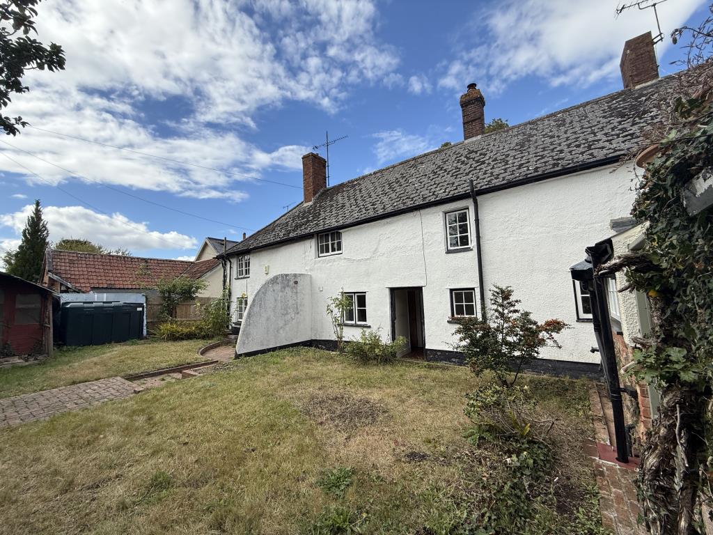 Lot: 181 - CHARACTER COTTAGE FOR UPDATING IN VILLAGE LOCATION - General view of rear garden and property